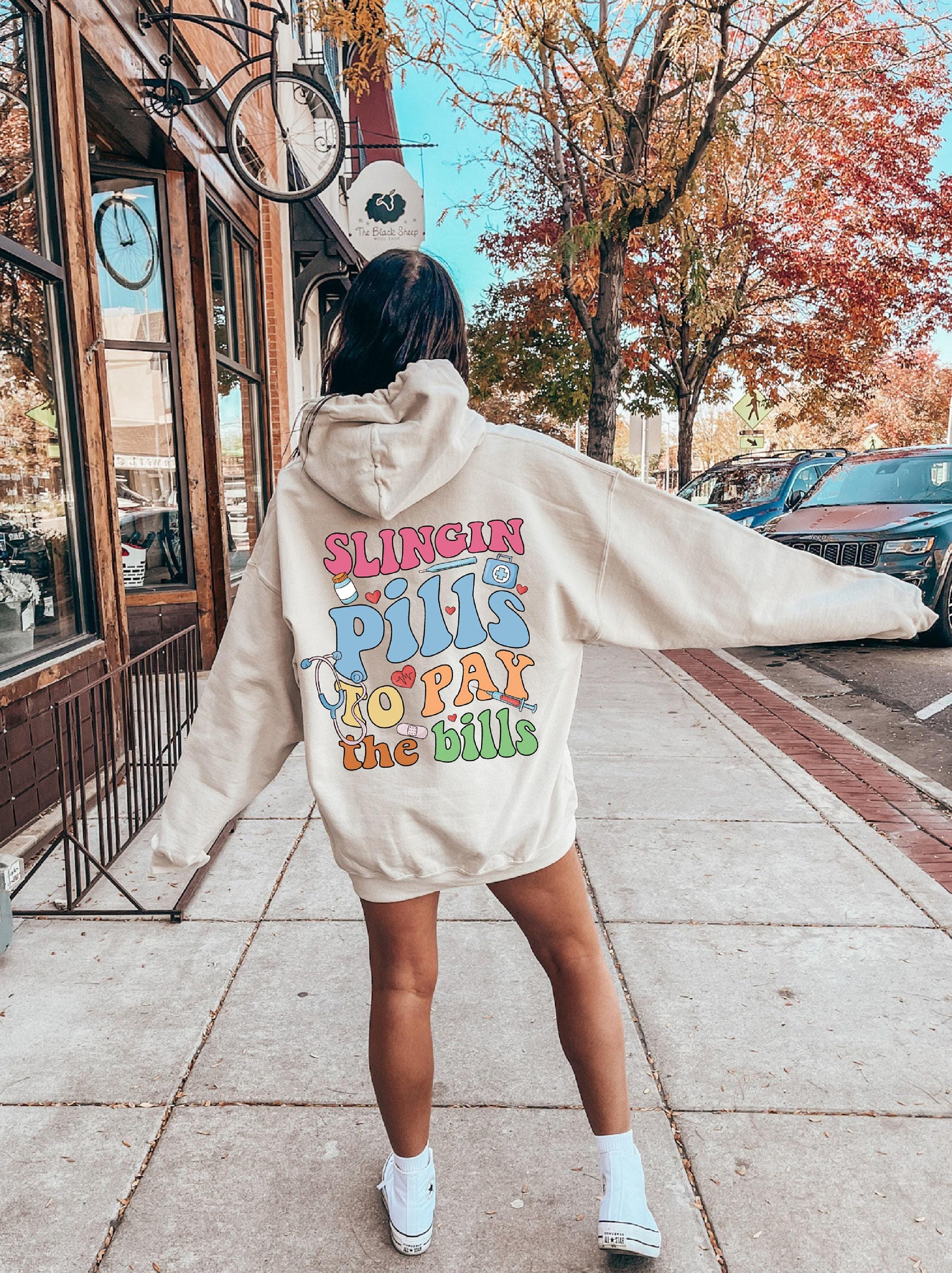 Slinging Pills To Pay The Bills Sweatshirt, Funny Nurse Shirt, RN Shirt For Women, Cute Nurse Tshirt, Nursing Student Graduation Gifts