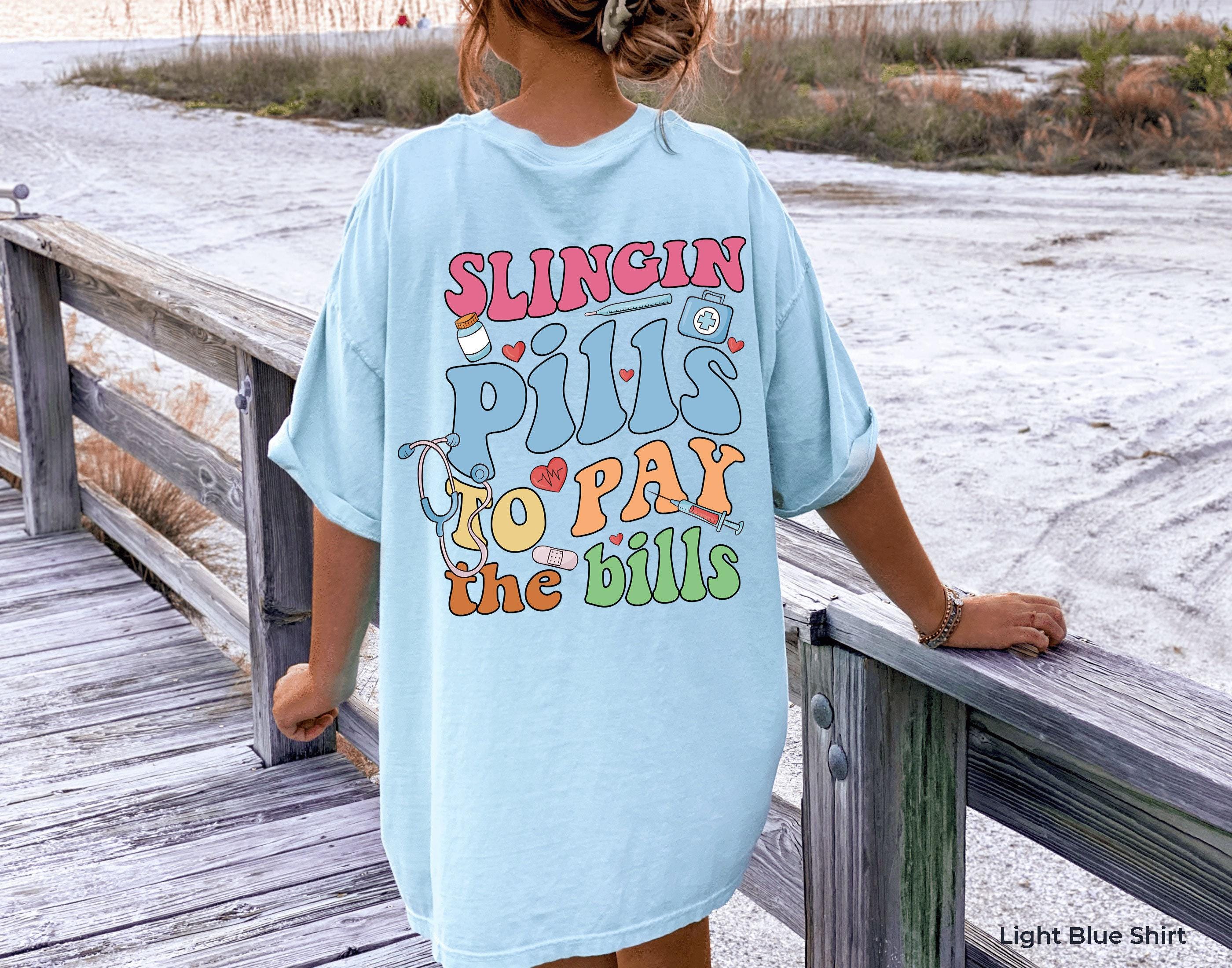 Slinging Pills To Pay The Bills Sweatshirt, Funny Nurse Shirt, RN Shirt For Women, Cute Nurse Tshirt, Nursing Student Graduation Gifts