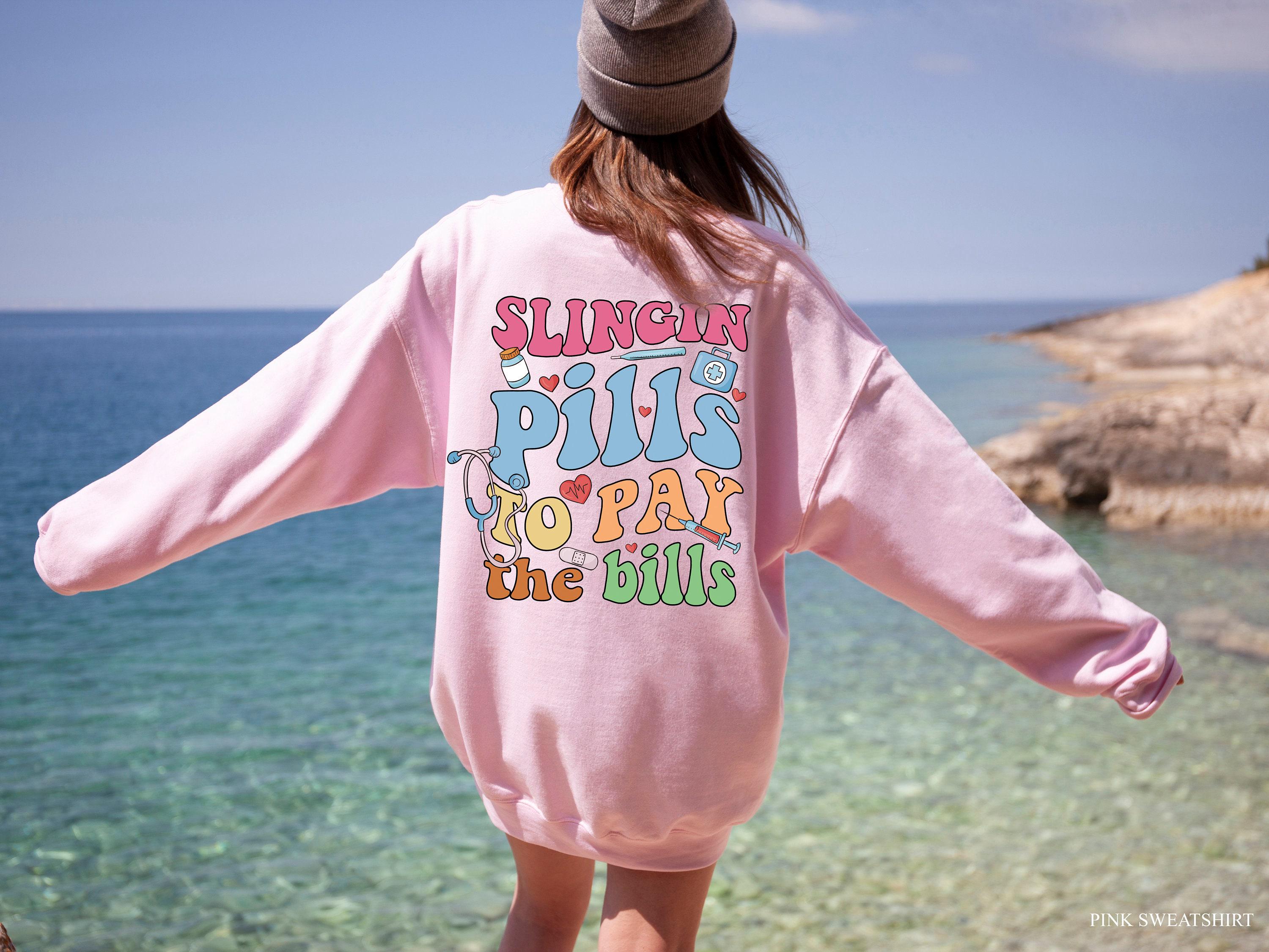 Slinging Pills To Pay The Bills Sweatshirt, Funny Nurse Shirt, RN Shirt For Women, Cute Nurse Tshirt, Nursing Student Graduation Gifts